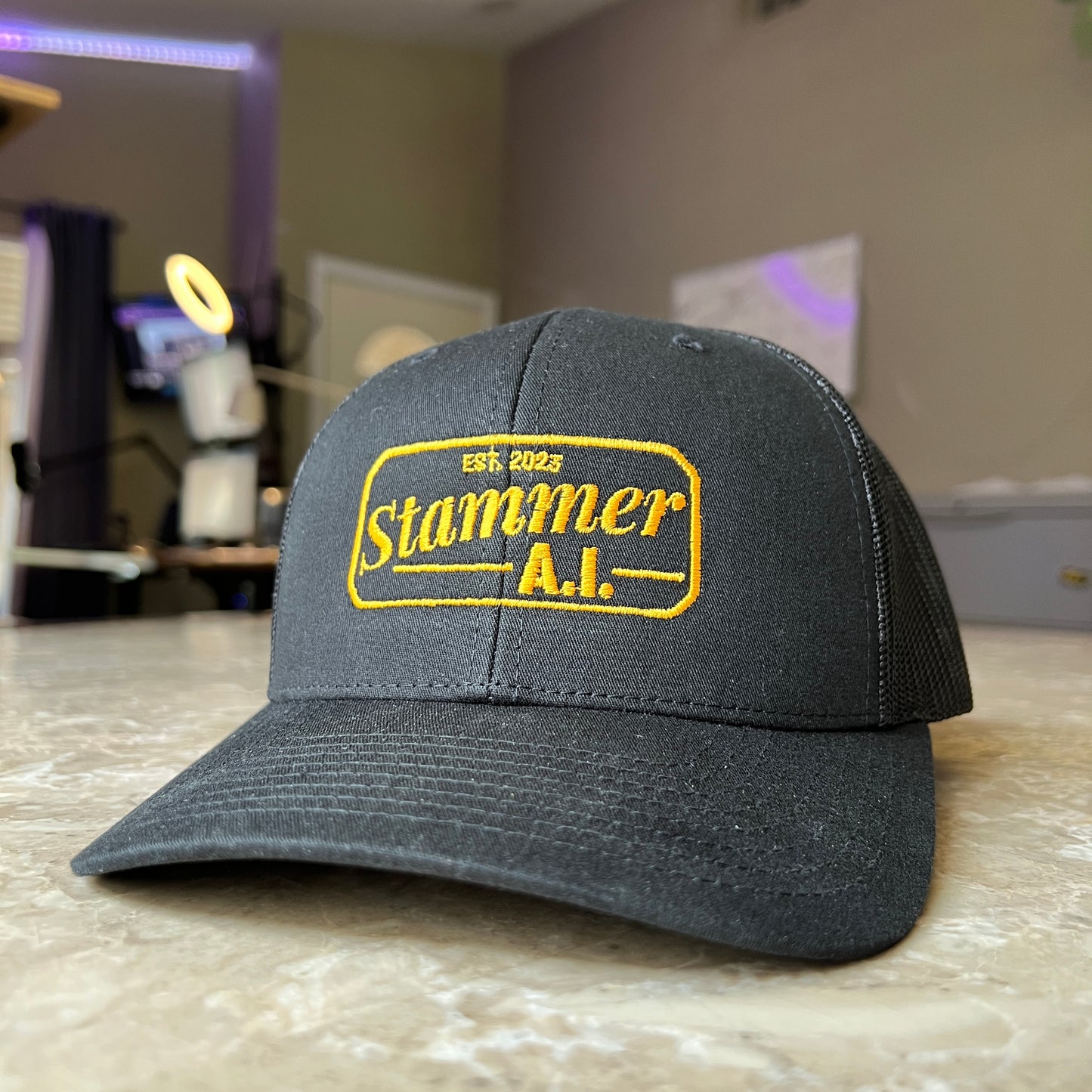 Stammer.ai Black & Gold Trucker Hat