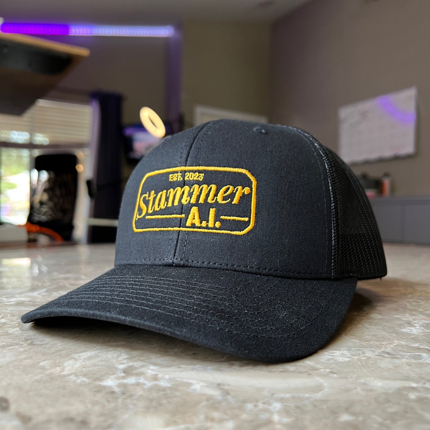 Stammer.ai Black & Gold Trucker Hat